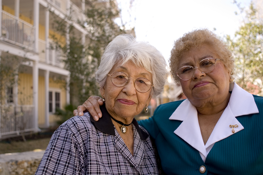 Two women standing in front of the Lyons Gardens property